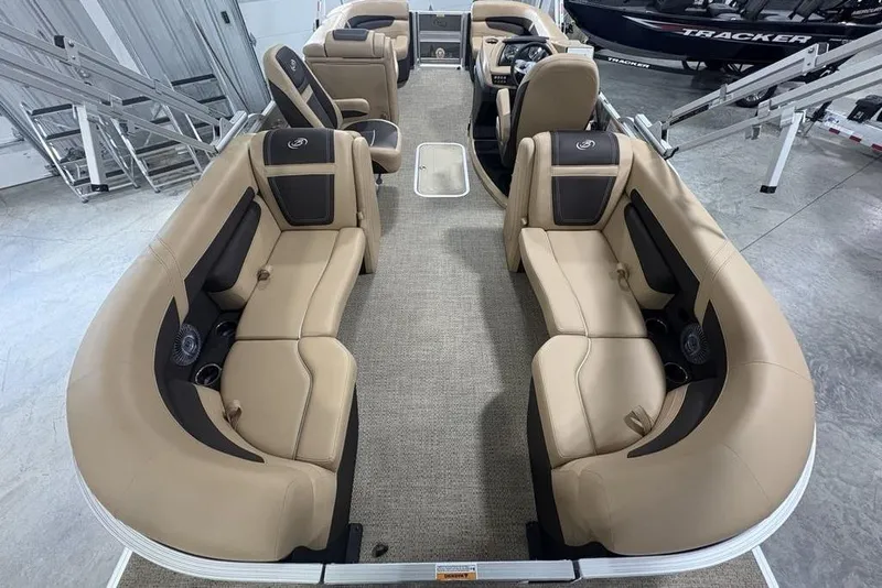 Slide: The Image of 2025 Barletta C22QC pontoon boat interior with beige seating and modern design. - 34