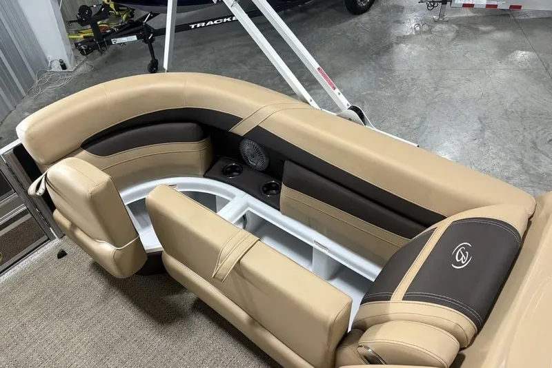 Slide: The Image of Luxurious seating on 2025 Barletta C22QC pontoon boat, featuring beige and brown upholstery. - 37