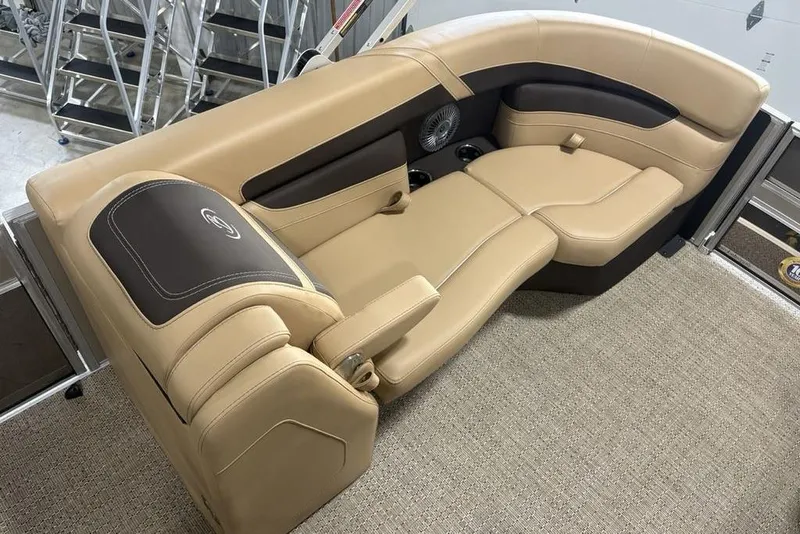 Slide: The Image of Luxurious seating in 2025 Barletta C22QC boat, featuring beige and brown upholstery. - 6