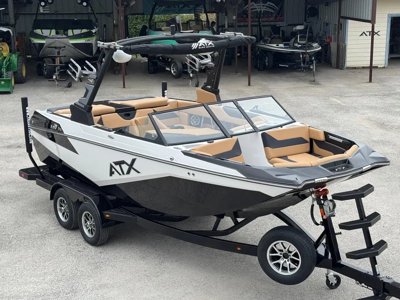 The Image of 2025 ATX Surf Boats 20 Type-S on trailer, sleek design, black and white exterior. - 0