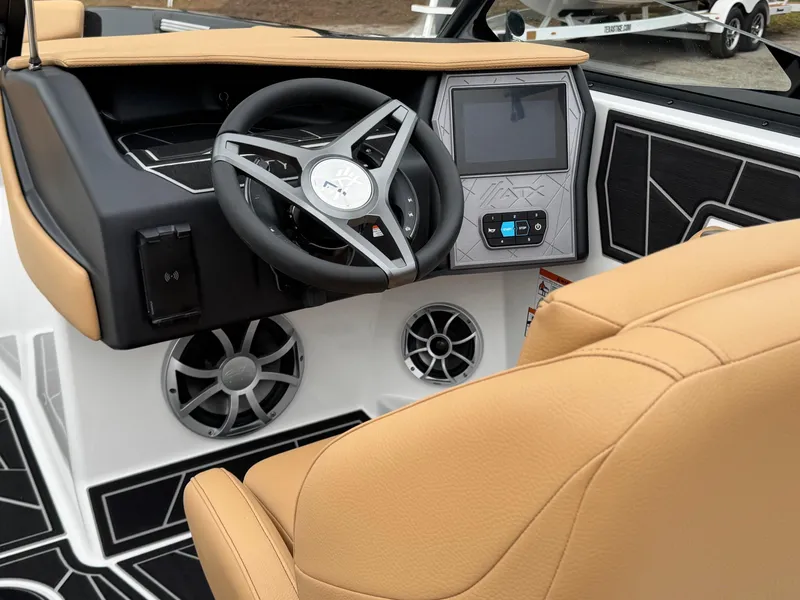 Slide: The Image of 2025 ATX Surf Boats 20 Type-S interior with tan seats and modern dashboard. - 12
