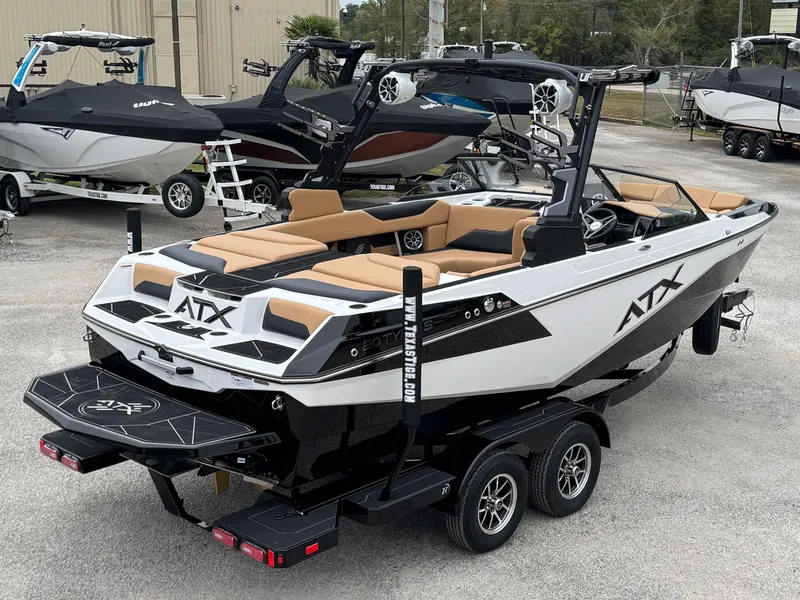 Slide: The Image of 2025 ATX Surf Boats 20 Type-S, sleek design, dual-axle trailer, outdoor display. - 4