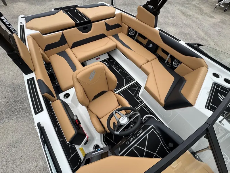 Slide: The Image of 2025 ATX Surf Boats 20 Type-S interior with tan and black seating, modern design. - 8