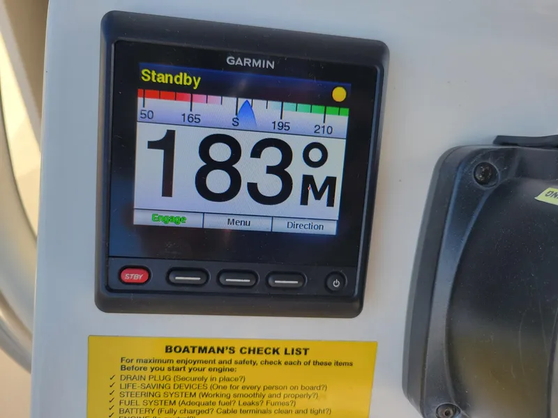 Slide: The Image of Garmin display on 2022 Key West 263 FS boat showing 183 meters in standby mode. - 12