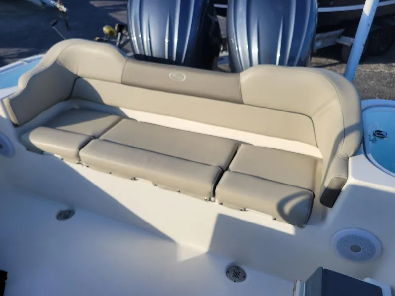 Slide: The Image of 2022 Key West 263 FS boat with beige seating and dual engines. - 14