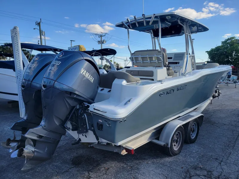 Slide: The Image of 2022 Key West 263 FS boat with dual Yamaha engines on trailer. - 3
