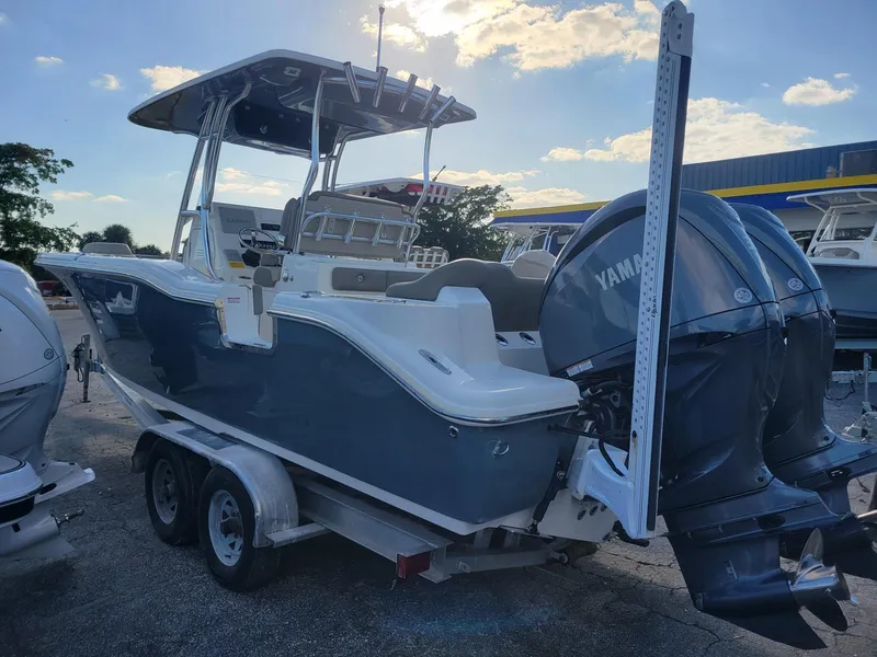 Slide: The Image of 2022 Key West 263 FS boat with Yamaha engines on a trailer. - 4