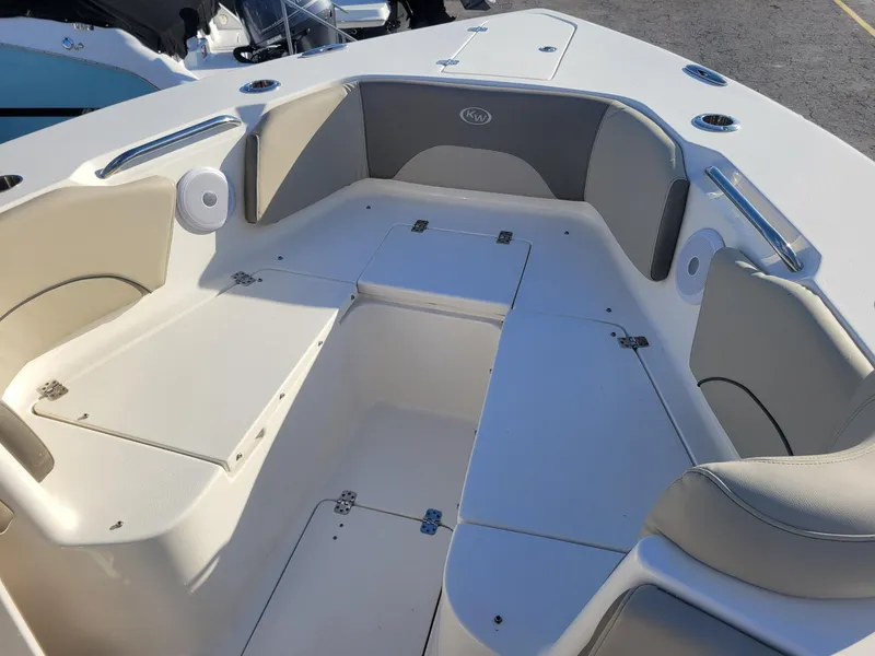 Slide: The Image of 2022 Key West 263 FS boat interior with seating and storage compartments. - 7