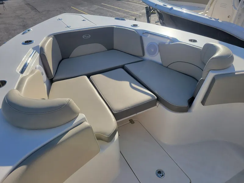 Slide: The Image of 2022 Key West 263 FS boat interior with cushioned seating area. - 9