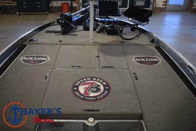 Slide: The Image of 2023 Bass Cat Puma STS boat interior with sponsor logos, including Jack Link's and Seven Brew. - 13