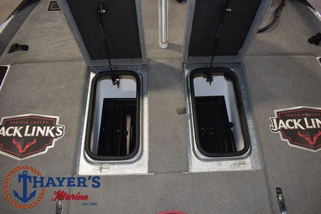 Slide: The Image of 2023 Bass Cat Puma STS boat deck with storage compartments and Jack Link's branding. - 15