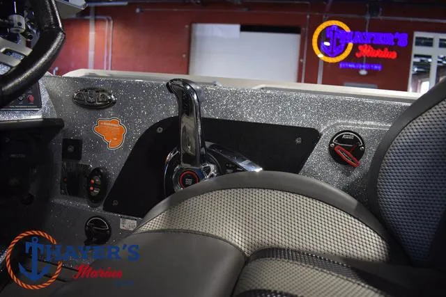 Slide: The Image of 2023 Bass Cat Puma STS boat interior with control panel and seating. - 20