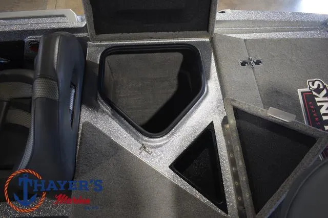 Slide: The Image of 2023 Bass Cat Puma STS boat interior with storage compartments and seating. - 27