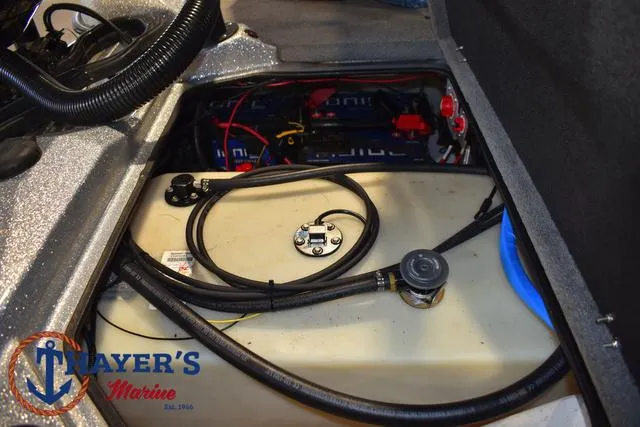Slide: The Image of 2023 Bass Cat Puma STS boat interior showing fuel tank and wiring components. - 29