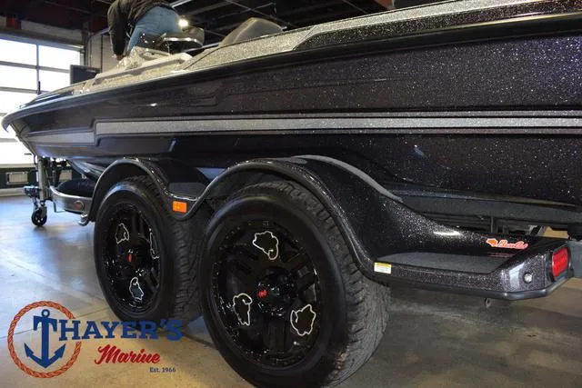 Slide: The Image of 2023 Bass Cat Puma STS boat on trailer at Thayer's Marine showroom. - 34
