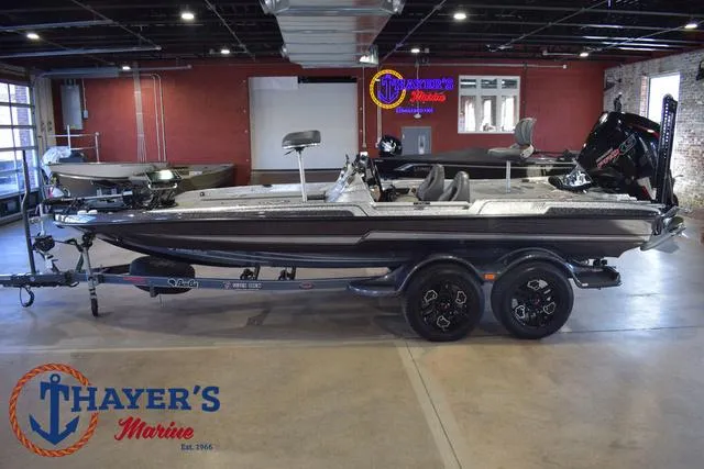 Slide: The Image of 2023 Bass Cat Puma STS boat displayed at Thayer's Marine showroom. - 37
