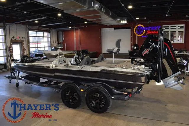 Slide: The Image of 2023 Bass Cat Puma STS boat displayed at Thayer's Marine showroom. - 38