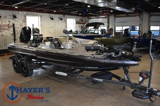Slide: The Image of 2023 Bass Cat Puma STS boat displayed at Thayer's Marine showroom. - 42