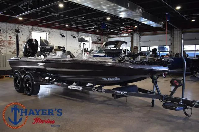 Slide: The Image of 2023 Bass Cat Puma STS boat displayed at Thayer's Marine showroom. - 43