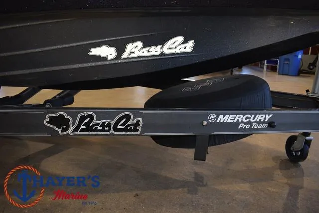 Slide: The Image of 2023 Bass Cat Puma STS boat trailer with Mercury Pro Team branding at Thayer's Marine. - 5