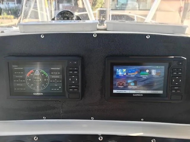 Slide: The Image of Garmin navigation displays on 1998 Boston Whaler 260 Outrage boat dashboard. - 12