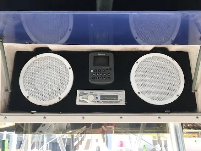 Slide: The Image of Boat audio system with speakers and control panel on a 1998 Boston Whaler 260 Outrage. - 14