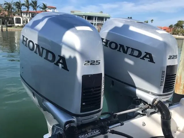 Slide: The Image of Twin Honda 225 outboard motors on a 1998 Boston Whaler 260 Outrage boat. - 19