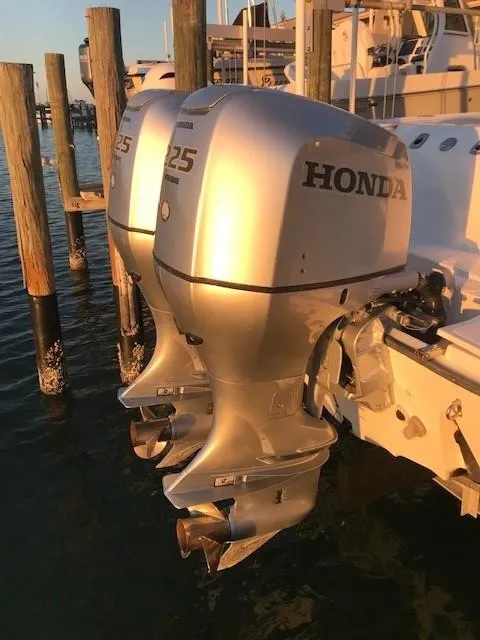 Slide: The Image of Twin Honda 225 outboard motors on a 1998 Boston Whaler 260 Outrage boat. - 21