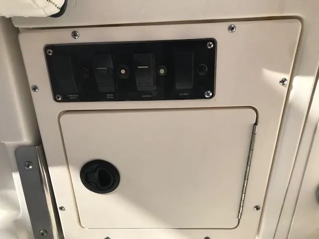 Slide: The Image of Control panel on a 1998 Boston Whaler 260 Outrage boat. - 26