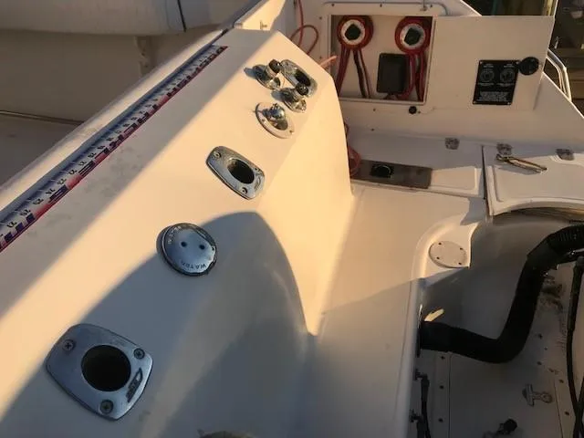 Slide: The Image of 1998 Boston Whaler 260 Outrage boat console with controls and gauges. - 27