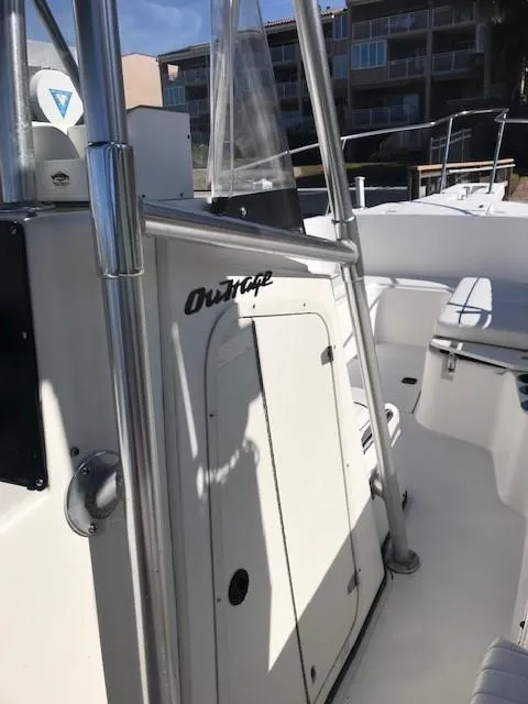 Slide: The Image of 1998 Boston Whaler 260 Outrage boat interior with console and seating. - 28