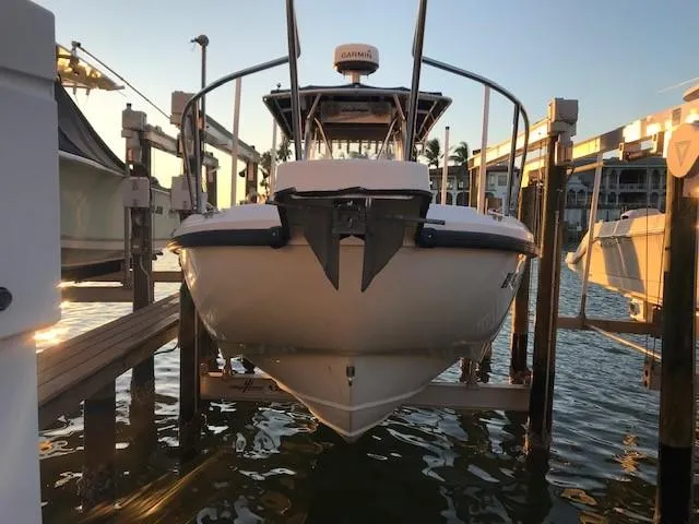 Slide: The Image of 1998 Boston Whaler 260 Outrage boat docked at sunset. - 3