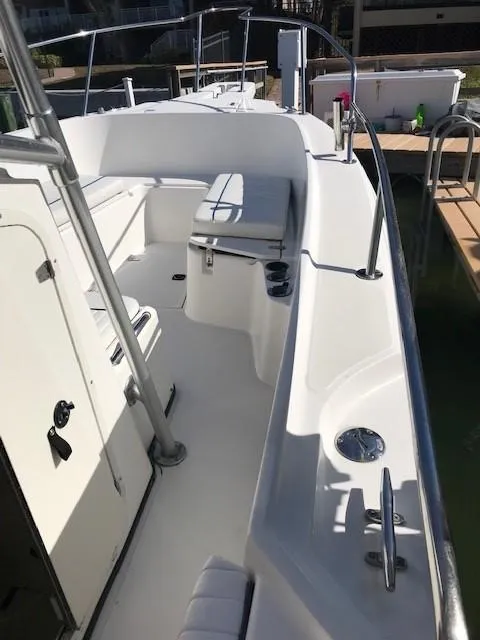 Slide: The Image of 1998 Boston Whaler 260 Outrage boat interior with seating and railing. - 31