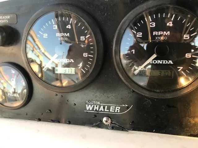 Slide: The Image of Close-up of 1998 Boston Whaler 260 Outrage dashboard with Honda RPM gauges. - 38