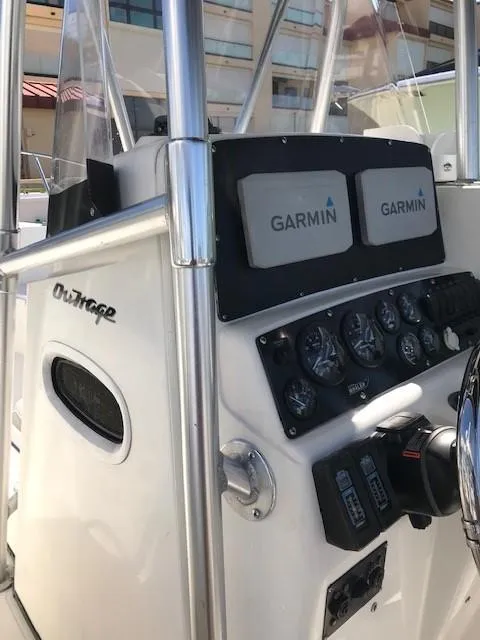 Slide: The Image of 1998 Boston Whaler 260 Outrage boat dashboard with Garmin navigation systems. - 8