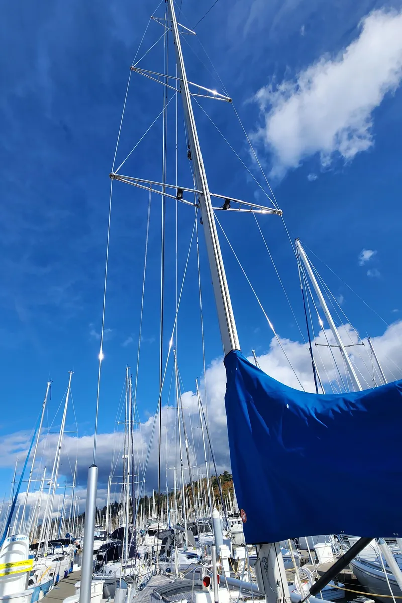 Slide: The Image of Sailboat mast of 1983 Nautor Swan 651 against a bright blue sky. - 11