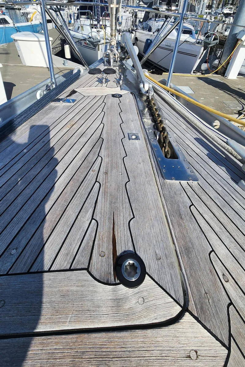 Slide: The Image of Deck of 1983 Nautor Swan 651 yacht with wooden finish and metal fittings. - 15