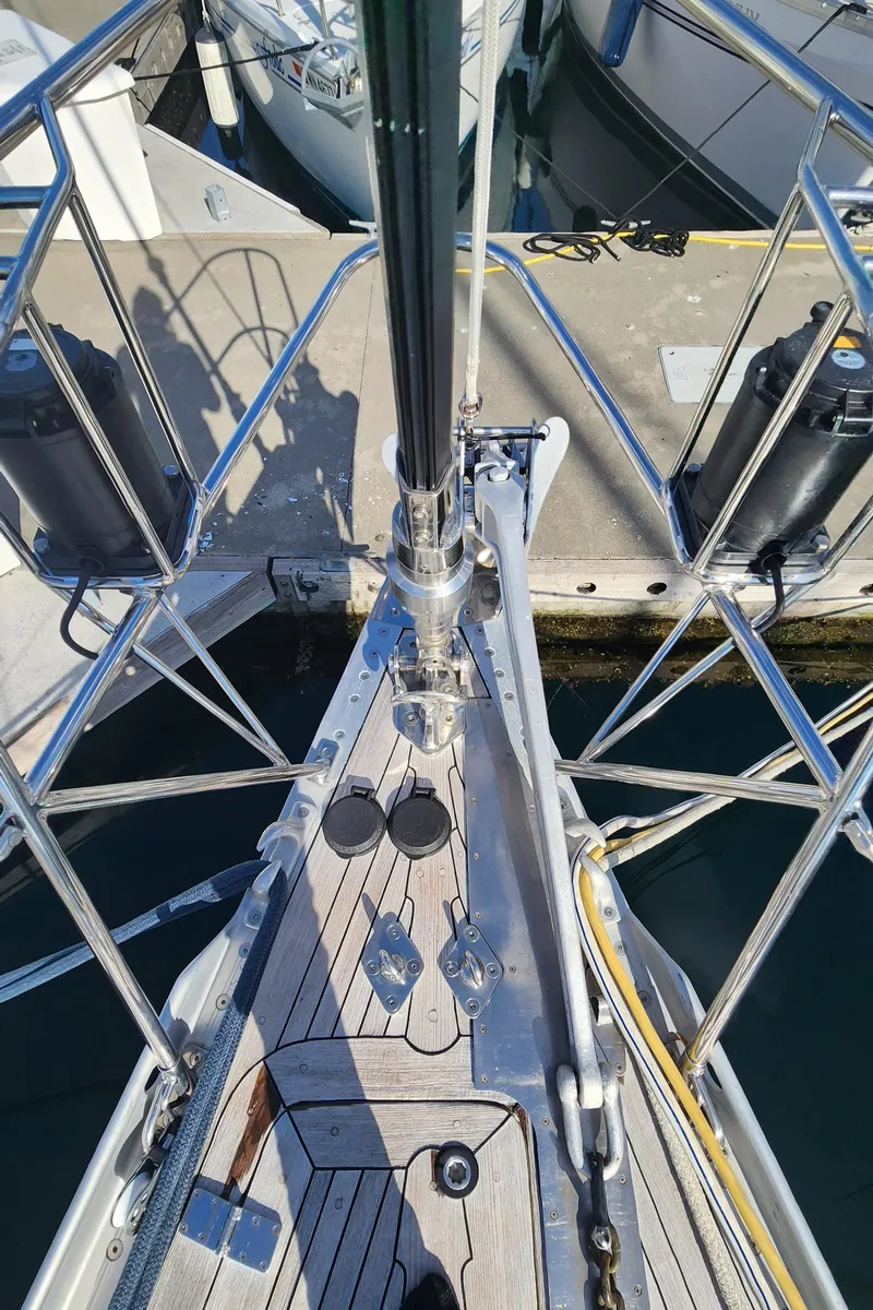 Slide: The Image of Bow view of 1983 Nautor Swan 651 yacht docked at marina. - 17