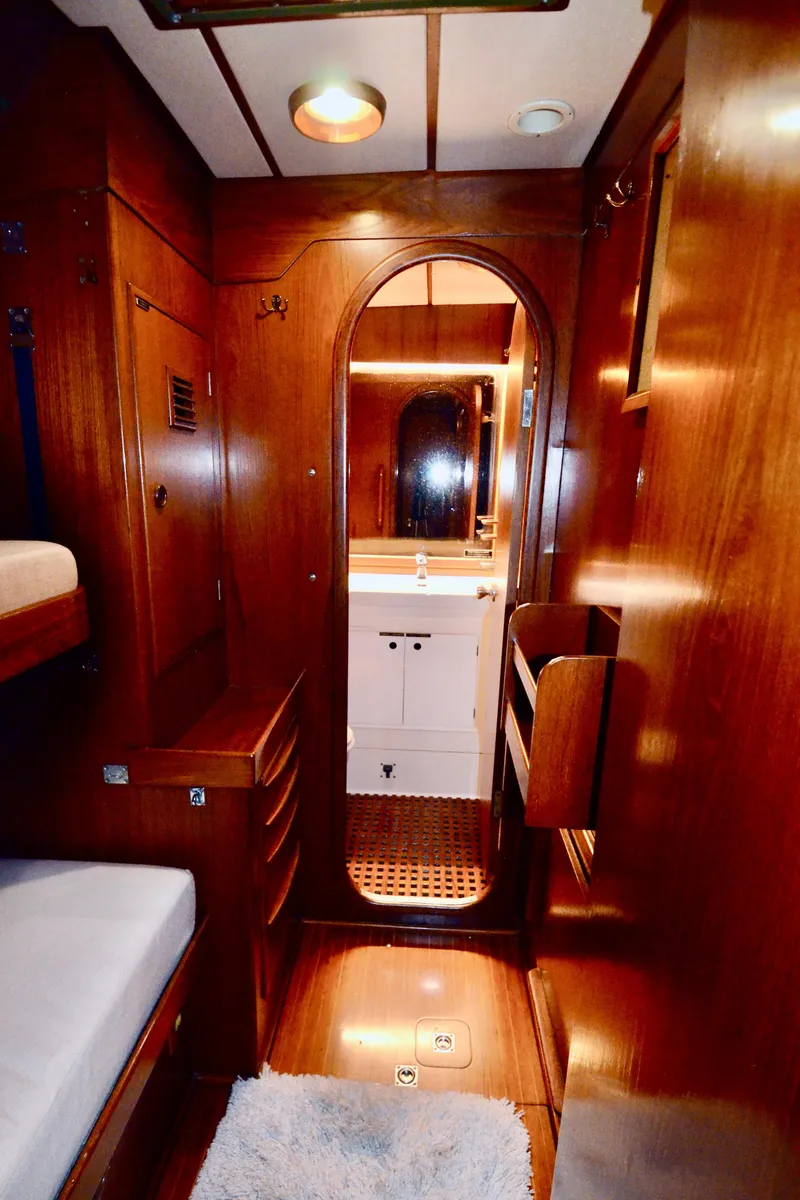 Slide: The Image of Luxurious wooden interior of 1983 Nautor Swan 651 yacht with cozy cabin and bathroom. - 33