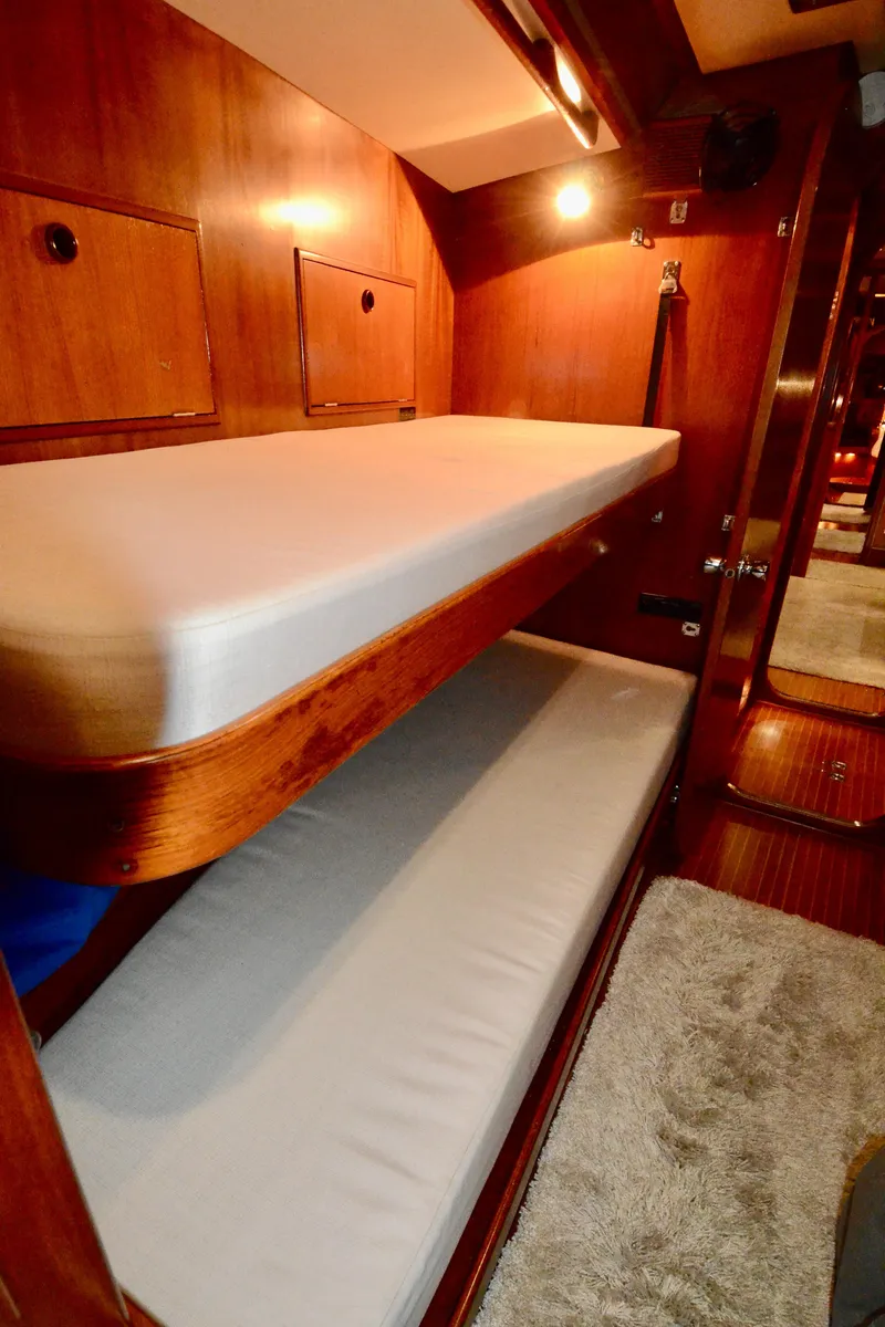 Slide: The Image of Interior of 1983 Nautor Swan 651 yacht with wooden bunk beds. - 35
