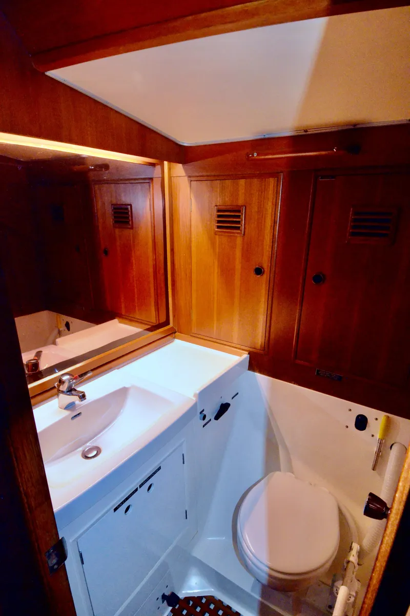 Slide: The Image of 1983 Nautor Swan 651 yacht bathroom with wooden cabinetry and compact design. - 36