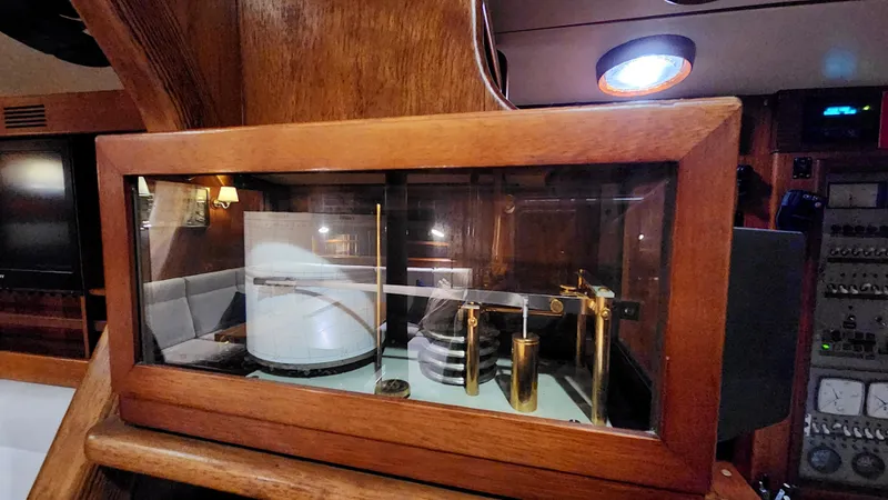 Slide: The Image of Interior of 1983 Nautor Swan 651 yacht featuring a classic barometer display. - 46