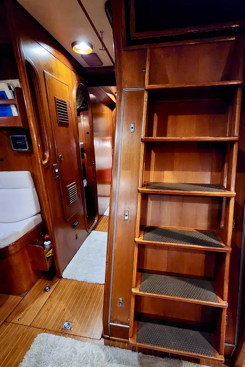 Slide: The Image of Interior of 1983 Nautor Swan 651 yacht with wooden cabinetry and ladder. - 47