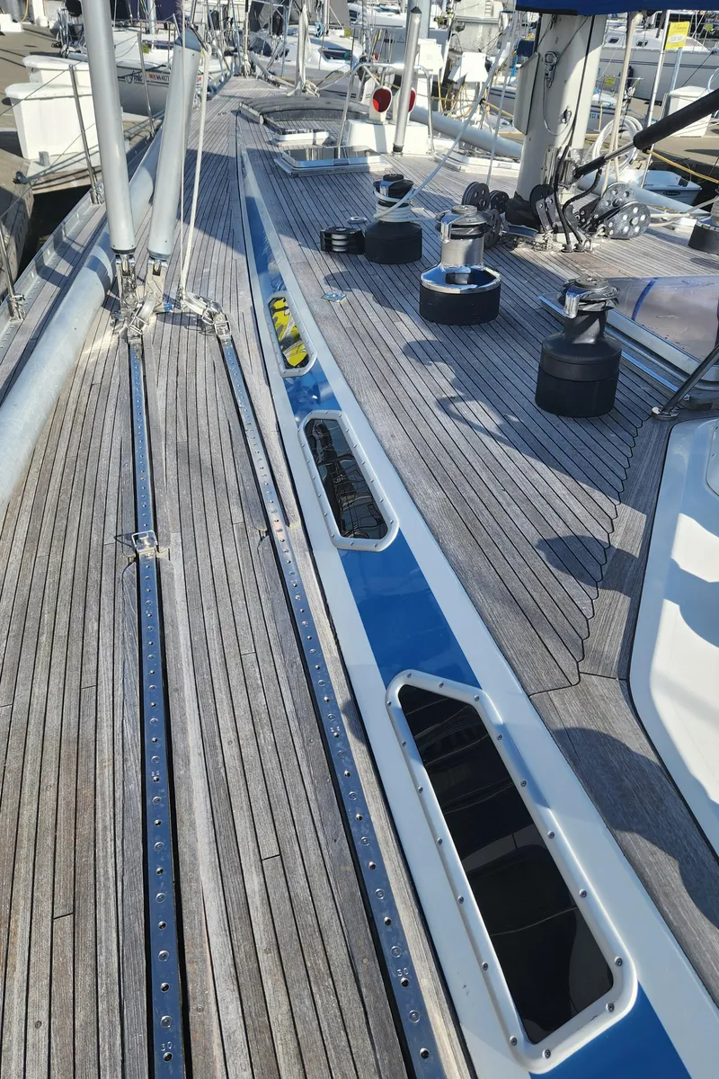 Slide: The Image of Deck view of 1983 Nautor Swan 651 yacht with wooden finish and sleek design. - 7