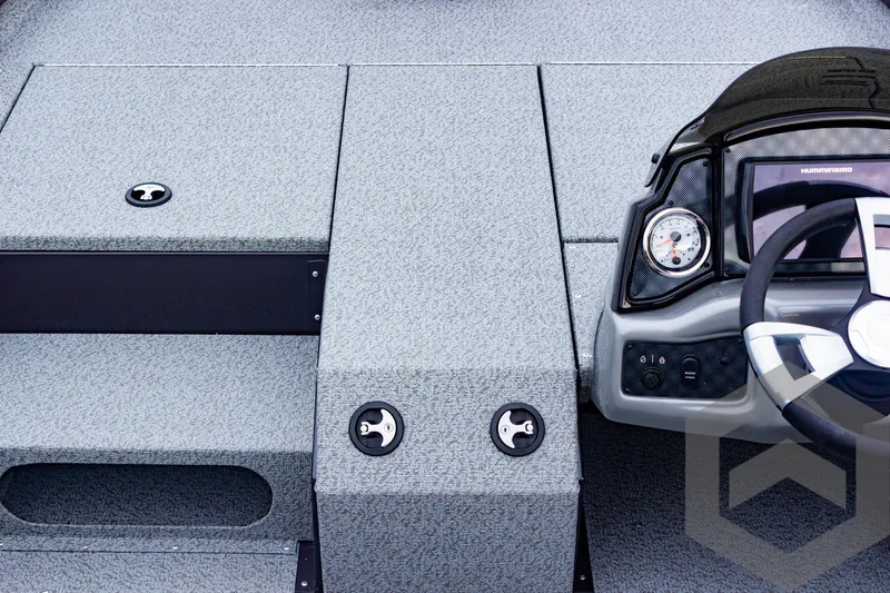 Slide: The Image of 2025 G3 Sportsman 1810 boat interior with steering console and storage compartments. - 17