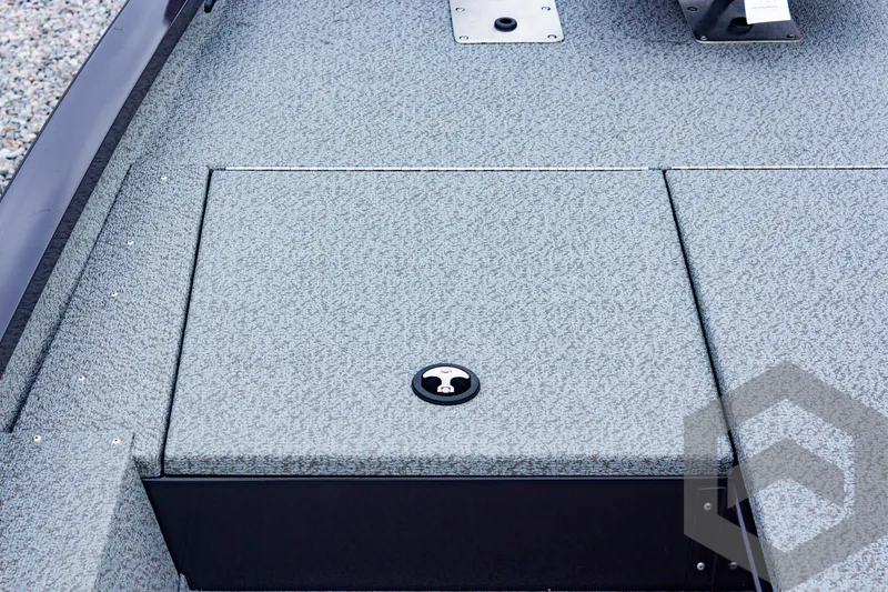 Slide: The Image of 2025 G3 Sportsman 1810 boat deck with storage compartment, textured surface. - 20