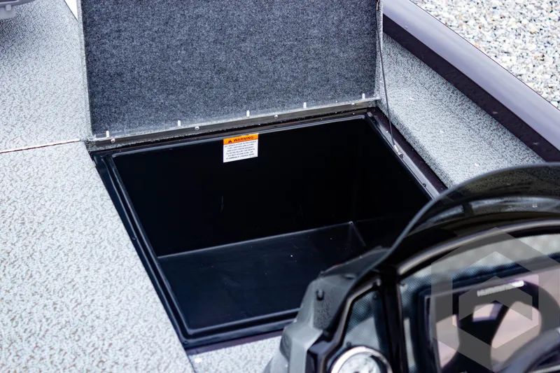 Slide: The Image of 2025 G3 Sportsman 1810 boat storage compartment, open and empty. - 23