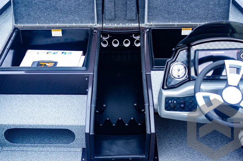 Slide: The Image of Interior of 2025 G3 Sportsman 1810 boat with storage compartments and steering console. - 24