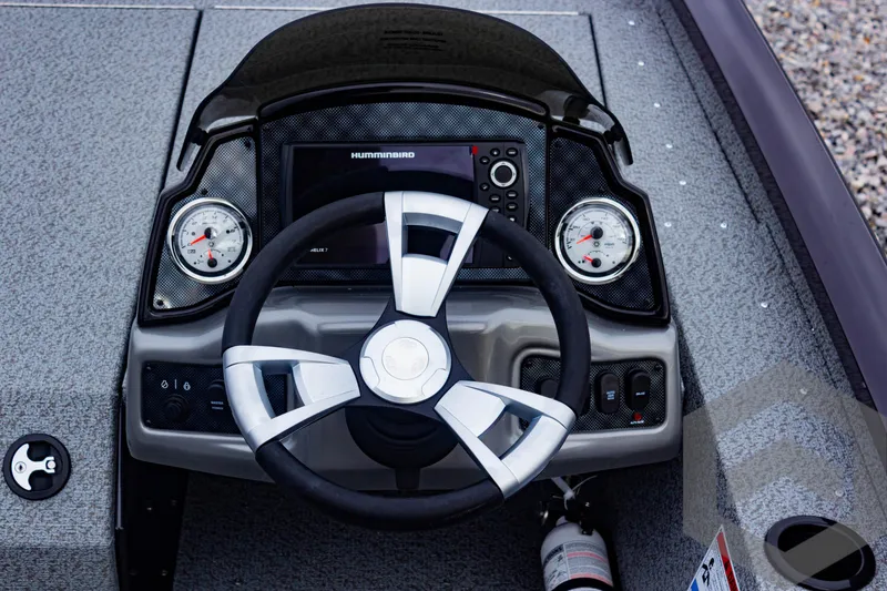 Slide: The Image of 2025 G3 Sportsman 1810 boat dashboard with steering wheel and gauges. - 34