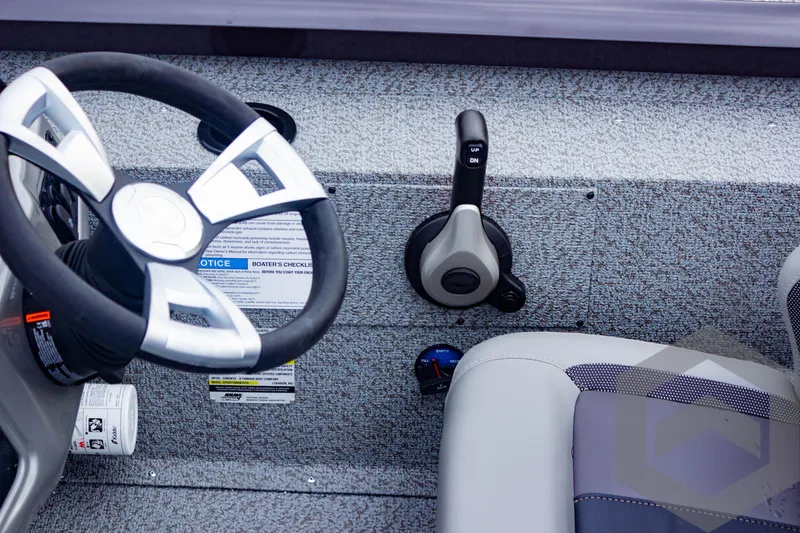 Slide: The Image of 2025 G3 Sportsman 1810 boat interior with steering wheel and control panel. - 35